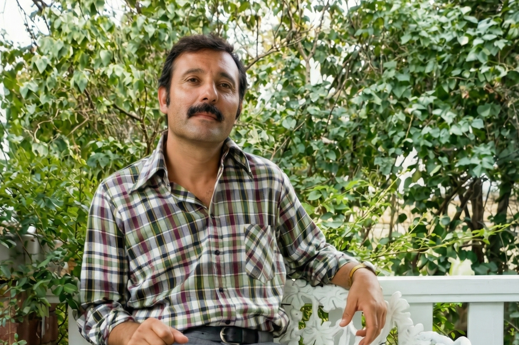 Young Opa sitting in garden